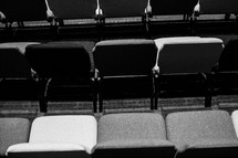 rows of auditorium chairs 