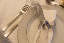 place setting and silver bow