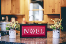 noel sign on a kitchen countertop 