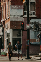 men standing on a street corner 