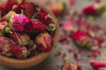 dried roses in a wooden bowl 