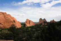 red rock peaks and forest 