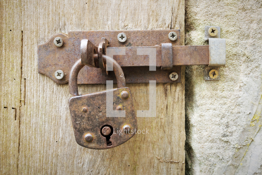 an old rusty lock and door latch 