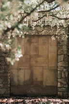spring blossoms and stone wall 