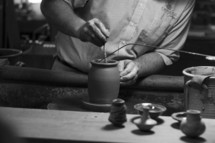 man using a pottery wheel 