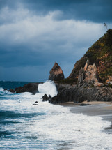 Waves of Stormy ocean crashing on rocks
