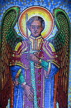mosaic tile of an angel holding a sword 
