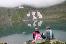 two women looking out at a lake, Hiking