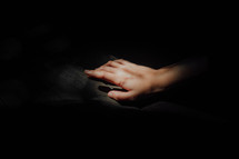 female hand in darkness 