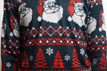 man in an ugly Christmas sweater with santas