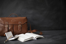 journal, purse, open Bible, pencil