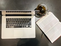 computer, tea and open Bible 