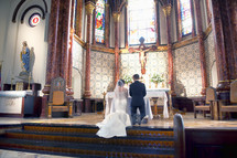 bride and groom at the altar 
