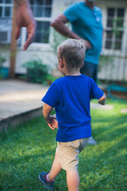 a child running in a backyard 