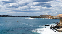 The castle of Syracusa Ortigia on the sea in cloudy day