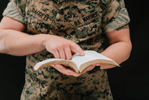 A marine reading a Bible 