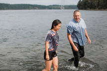 baptism in a river - walking out of the water 