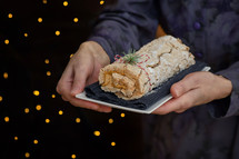 Roulade With Coffee Cream And Holiday Glitter in Background