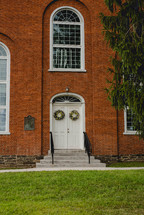 spring wreathes on church doors 