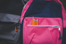Book bags with pencils in the pocket, ready for back to school or school