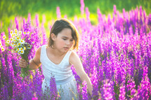 a child picking flowers 
