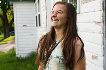 a teen girl laughing 