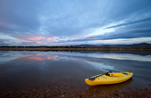 kayak on a lake shore 