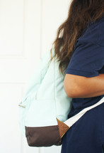 teen girl with a book bag 