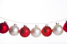 red and white Christmas ornaments hanging 