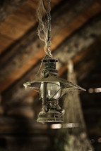 cobwebs on an old hanging lantern 