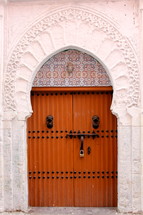 Wooden door to a mosque entrance.