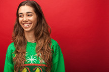 a headshot of a woman in a Christmas sweater t-shirt 