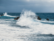 Splash of Ocean crashing on the cliff in Calabria region