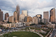 city park surrounded by skyscrapers 