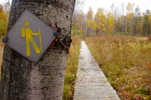 hiking trail sign and path 