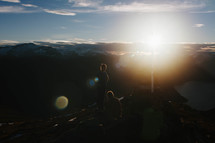 men on a mountain peak at sunrise 