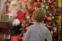 portrait of Boy with Cochlear Implants in front of Santa 