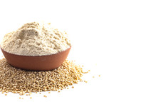 A Bowl of Quinoa Flour Isolated on a White Background