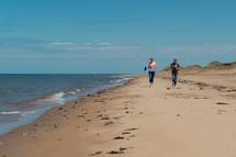 couple walking on a beach 