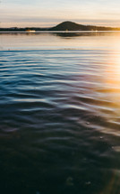 ripples in lake water at sunset 