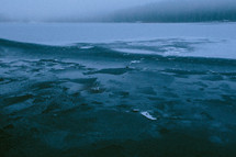 wet sand along a lake shore in winter 