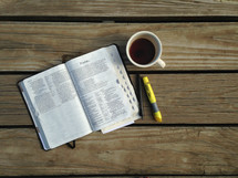 a Bible on a dock 
