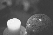 A candle and a globe. 