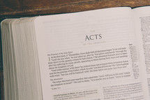 Bible opened to Acts 