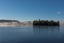 mist along a lake shore 