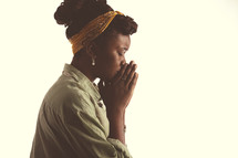 african american teen girl in prayer.