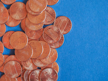 One Cent Dollar coins money (USD), currency of United States over blue background
