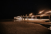 lights on a pier at night 