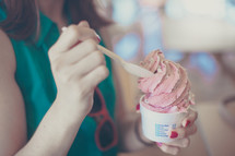 woman eating a cup of ice cream