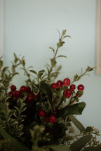 red berries in a Christmas flower arrangement 